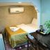 Lotus Hotel Istanbul room with bed, desk, TV, and wall-mounted air conditioner