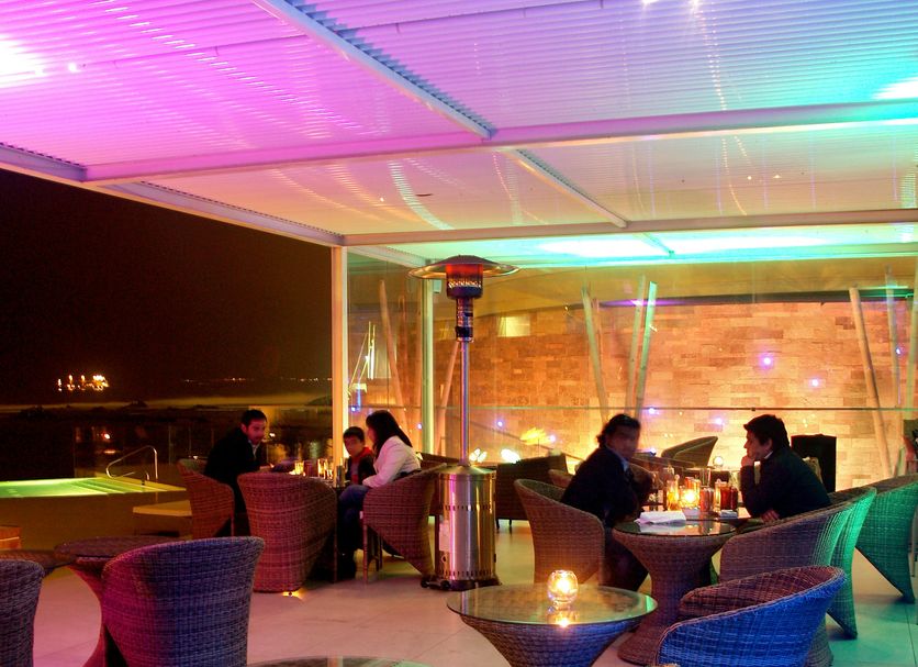 Terrado Suites Antofagasta rooftop terrace with lounge seating and city view in Antofagasta