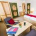 Gästehaus Enzianhof Hotel Garni in Oberammergau room with double bed, seating area, and table