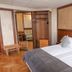 Sporting in Breuil-Cervinia guest room with double bed, open wardrobe and parquet floor