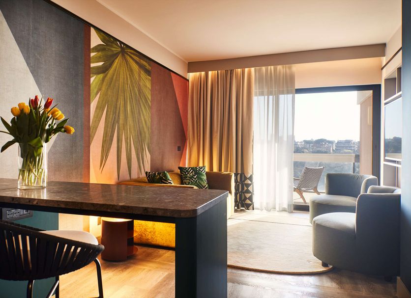 Hotel Villa Pamphili Roma room with desk, lounge chair and balcony view in Rome