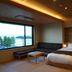 Dantokan Kikunoya in Ōtsu with twin beds, sofa, and large window overlooking the water
