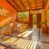 Pousada Ecoilha in Ilhabela, sunlit rustic lounge with wooden furniture and tile floor