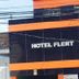 Hotel Flert Santana exterior in Sao Paulo with black facade and orange accents