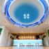 La'gent Hotel Okinawa Chatan lobby with glowing circular ceiling light and modern front desk in Chatan