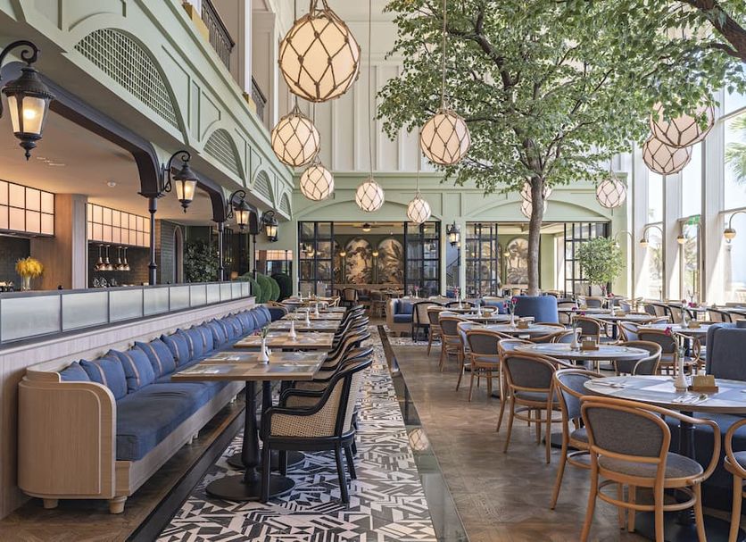 Hualien Farglory Hotel in Shoufeng Township: airy restaurant with long banquette seating and hanging globe lights