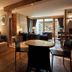 Hotel Maribel in Madonna di Campiglio: cozy suite with seating area and mountain-view windows