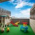Courtyard by Marriott Shanghai International Tourism and Resorts Zone kids' play area with slide and toys