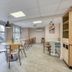 Premiere Classe Lyon Est Aeroport Saint Exupery breakfast room with tables, chairs and large windows