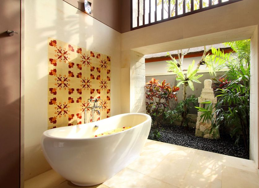 Sudamala Resort, Sanur, Bali bathroom with freestanding tub and garden view in Denpasar