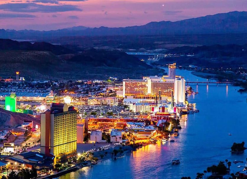 Grand Canyon West Hotel Sheps Miners Inn in Chloride with city lights and waterfront harbor at dusk
