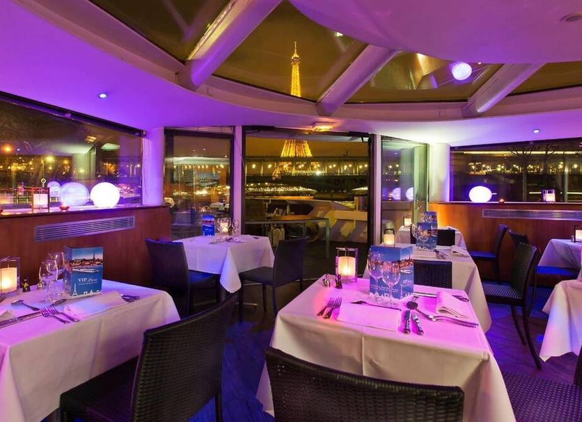 Vip Paris Yacht Hôtel & Spa in Paris, purple-lit dining room with Eiffel Tower view
