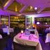 Vip Paris Yacht Hôtel & Spa in Paris, purple-lit dining room with Eiffel Tower view