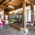 Domaine de Bassilour in Bidart: rustic lobby with wooden staircase, stone floor, and exposed beams