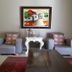 Old House Lodge in Beaufort West: seating area with two armchairs, side table, lamp and framed artwork