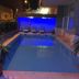Vesta Apart Hotel in Kusadasi with a lit outdoor pool and lounge chairs at night