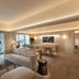 Conrad Singapore Orchard suite with city view, sofa, dining table and balcony in Singapore