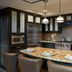 Waldorf Astoria Park City kitchen with granite island, bar stools and stainless steel appliances