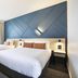 Nightcap at Sandown Park Hotel, Noble Park: modern twin hotel room with geometric blue accent wall