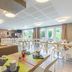 Appart'City Classic Reims Parc des Expositions breakfast room with tables, chairs and large windows