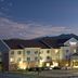 Fairfield Inn & Suites by Marriott Colorado Springs North/Air Force Academy exterior at dusk with mountain backdrop