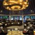 Atmosphere Kanifushi Maldives restaurant with circular buffet counters and ocean views in Kanifushi