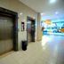 High Point Surabaya hotel lobby with two elevator doors and tiled hallway