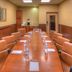 Hampton Inn & Suites Ontario meeting room with long conference table and tan chairs