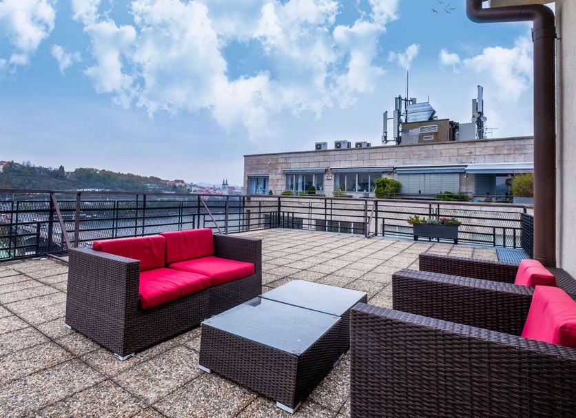 Clarion Hotel Prague Old Town rooftop terrace with seating and city views in Prague