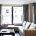 Allegroitalia San Pietro All'Orto 6 Milan room with large window, sectional sofa and TV