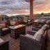 Kokopelli Inn Sedona patio with fire pit, lounge seating and sunset mountain views in Sedona