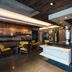 The Preston House and Hotel lobby in Riverhead with marble reception desk, seating area and bar