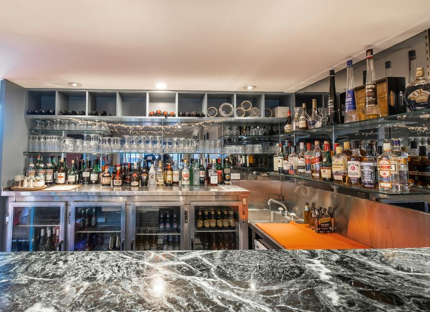 Twin Towers Inn Artarmon hotel bar with marble counter, stocked bottles and glassware