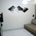 Resort L'acqua Diroma V room in Caldas Novas with sofa bed, wall art and curtained window