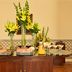 Pousada Palácio de Queluz buffet table with yellow floral arrangements and desserts in Queluz