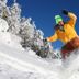 Elliott House Boutique Inn in Shaver Lake: snowboarder carving down a snowy slope under bright sun