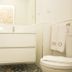 Bo - Álvares Cabral Guesthouse bathroom in Porto with glass shower, floating sink and toilet