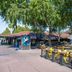 DoubleTree by Hilton Hotel Campbell - Pruneyard Plaza outdoor dining patio with trees in Campbell