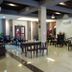 Swiss Hotel Heritage Boutique Melaka lobby lounge with tables, chairs and polished tile floors in Malacca
