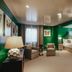 The Winston Solvang in Solvang: green-walled guest room with bed, armchair, sofa and windows