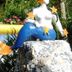 Art Hotel Aos Sinos Dos Anjos in Arraial d'Ajuda, mermaid statue beside a pool with tropical greenery