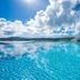 Oriental Hills Okinawa in Onna: infinity pool overlooking the ocean and cloudy blue sky