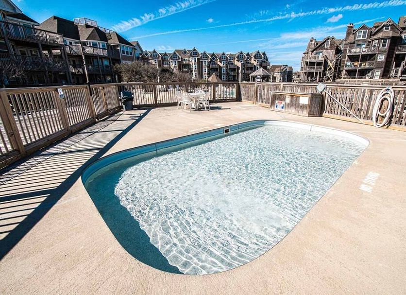 Barrier Island Station in Duck, outdoor pool with deck and surrounding condominium buildings