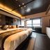 Livemax Resort Aki Miyajima guest room with twin beds and window seating in Hatsukaichi