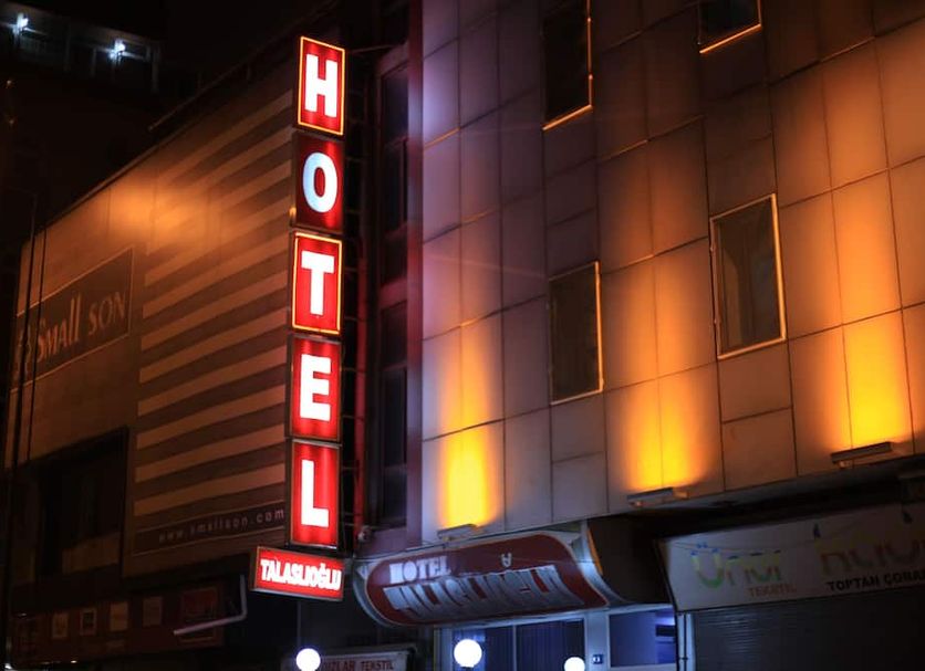 Talaslioglu Hotel in Kayseri with a lit vertical hotel sign at night