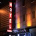 Talaslioglu Hotel in Kayseri with a lit vertical hotel sign at night