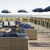 SpringHill Suites by Marriott Navarre Oceanfront patio with seating and ocean view in Navarre