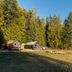 Backeddy Resort And Marina in Egmont with cabins by the waterfront and forested mountain views