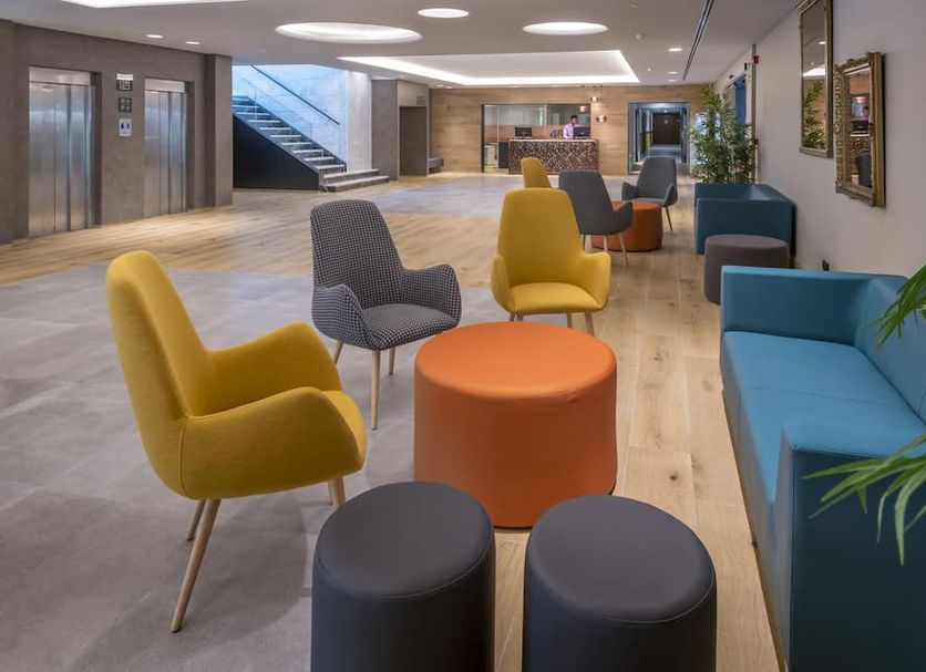 4R Gran Europe, Coma-ruga lobby lounge with colorful chairs, sofas and elevator area
