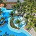 Meliá Habana, Havana: aerial view of a tropical resort pool with palm trees and thatched hut